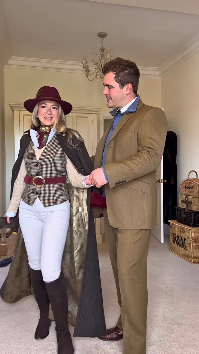 A man and woman posing in elegant British country style clothing indoors.